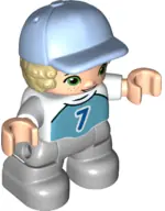 47205PB087:  Duplo Figure Lego Ville, Child Boy, Light Bluish Gray Legs, Medium Azure Top with Number 7, Tan Hair, Bright Light Blue Cap (6349785)