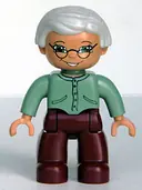 Minifigurka: 47394PB030:  Duplo Figure Lego Ville, Female, Dark Red Legs, Sand Green Sweater, Very Light Gray Hair, Green Eyes, Glasses (4208136)