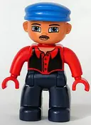 Minifigurka: 47394PB062:  Duplo Figure Lego Ville, Male, Dark Blue Legs, Red Top with Black Vest, Red Hands, Blue Cap, Blue Eyes, Moustache
