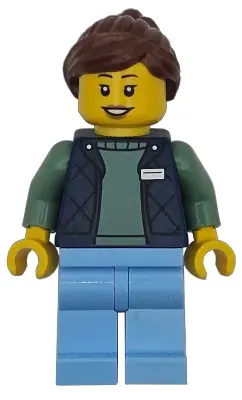 CTY1952:  Delivery Worker - Female, Dark Blue Bodywarmer over Sand Green Sweater, Bright Light Blue Legs, Reddish Brown Hair, Hearing Aid