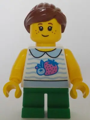 TWN470:  Child - Girl, White Collared Shirt with Fruit, Green Short Legs, Reddish Brown Ponytail, Freckles